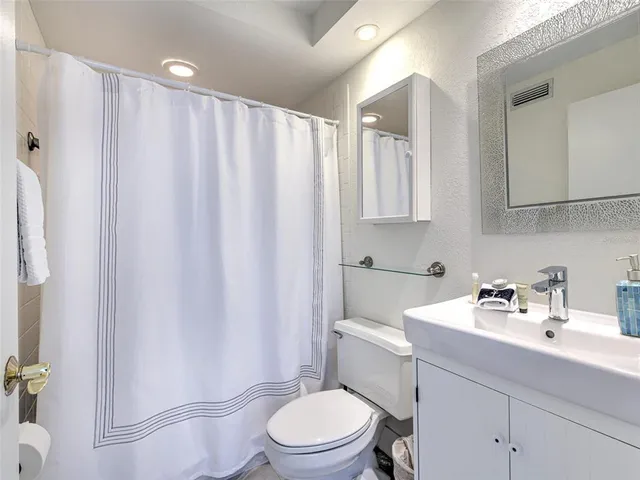 a view of a chairs and table in a patio