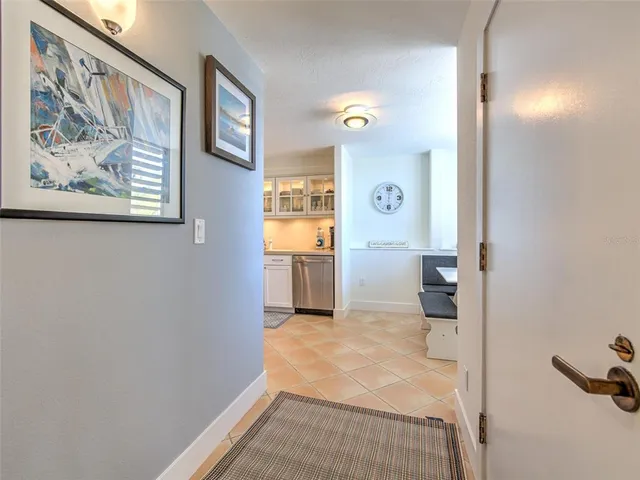 a kitchen with stainless steel appliances a sink cabinets and a window