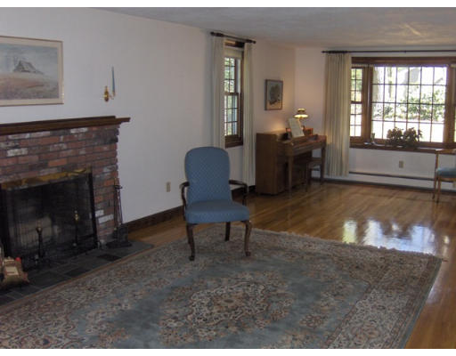 27 Downing Road Lexington, MA 02421 - Photo 2 of 11 a living room with furniture and a fireplace