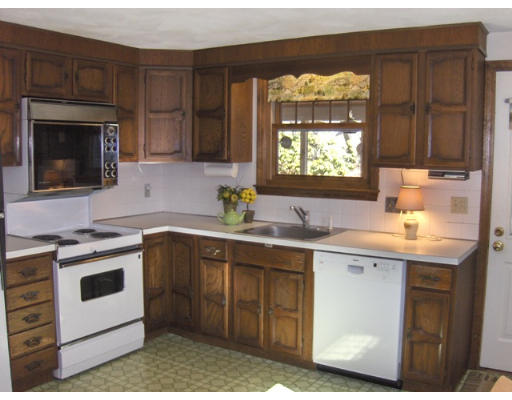 27 Downing Road Lexington, MA 02421 - Photo 6 of 11 a kitchen with a sink stove and cabinets