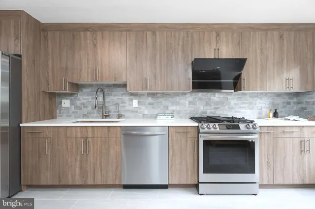 a kitchen with a stove and a microwave