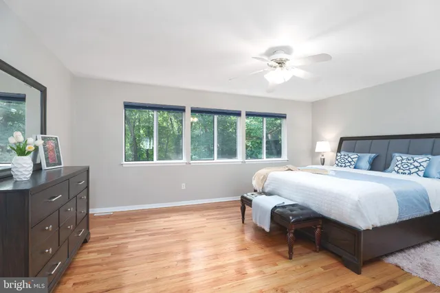 a bedroom with a large bed and a window