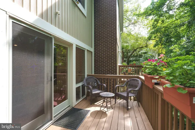 a view of balcony with wooden floor