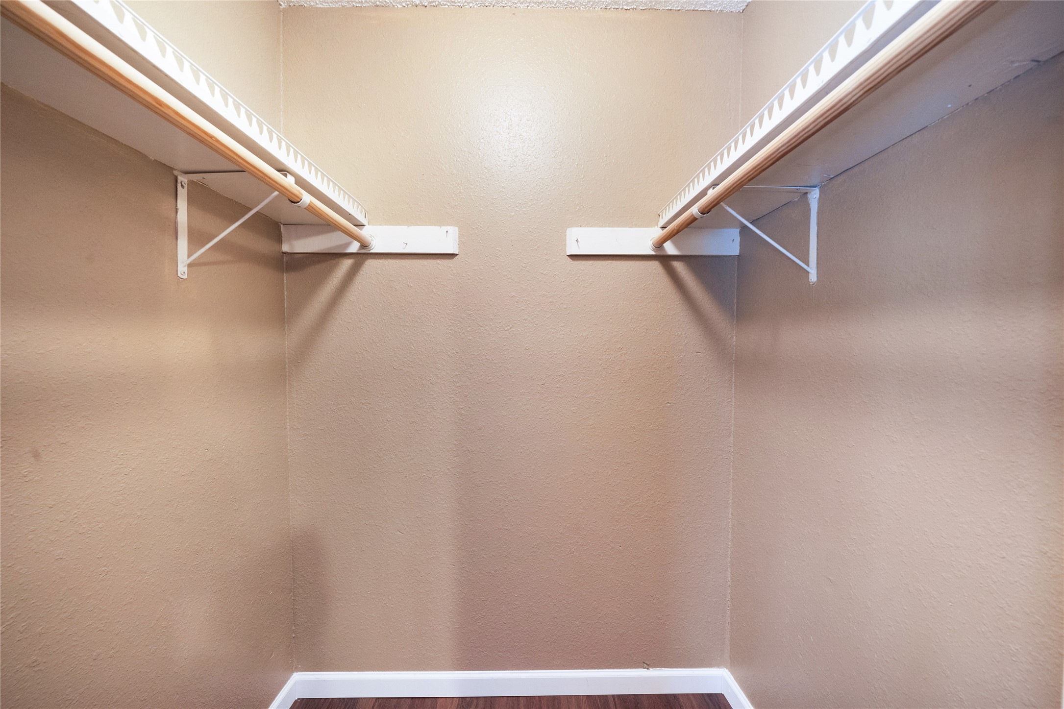 5412 Atascosa Drive, Unit B Austin, TX 78744 - Photo 15 of 15 Walk in closet featuring dark wood-type flooring