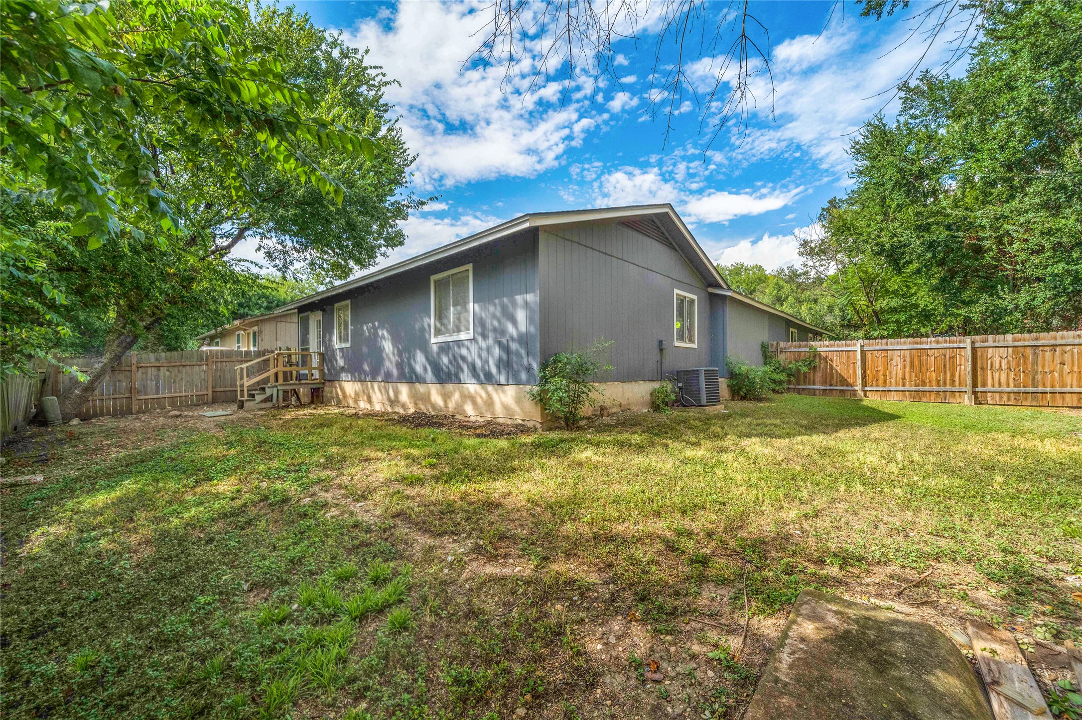 5412 Atascosa Drive, Unit B Austin, TX 78744 - Photo 3 of 15 Back of property with a fenced backyard