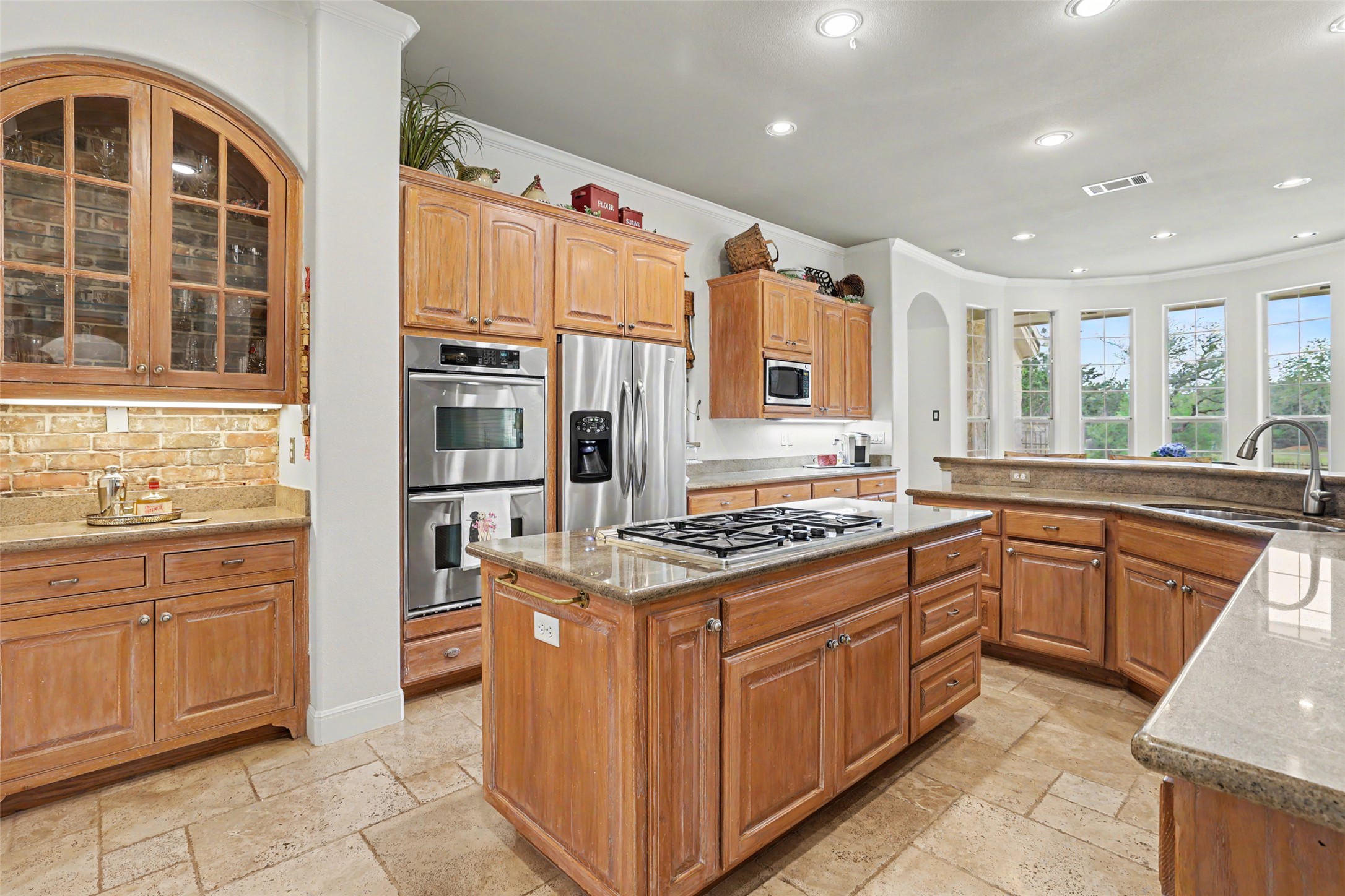 426 Logan Ranch Road Georgetown, TX 78628 - Photo 13 of 40 Double ovens and a propane cooktop lend to the dream kitchen