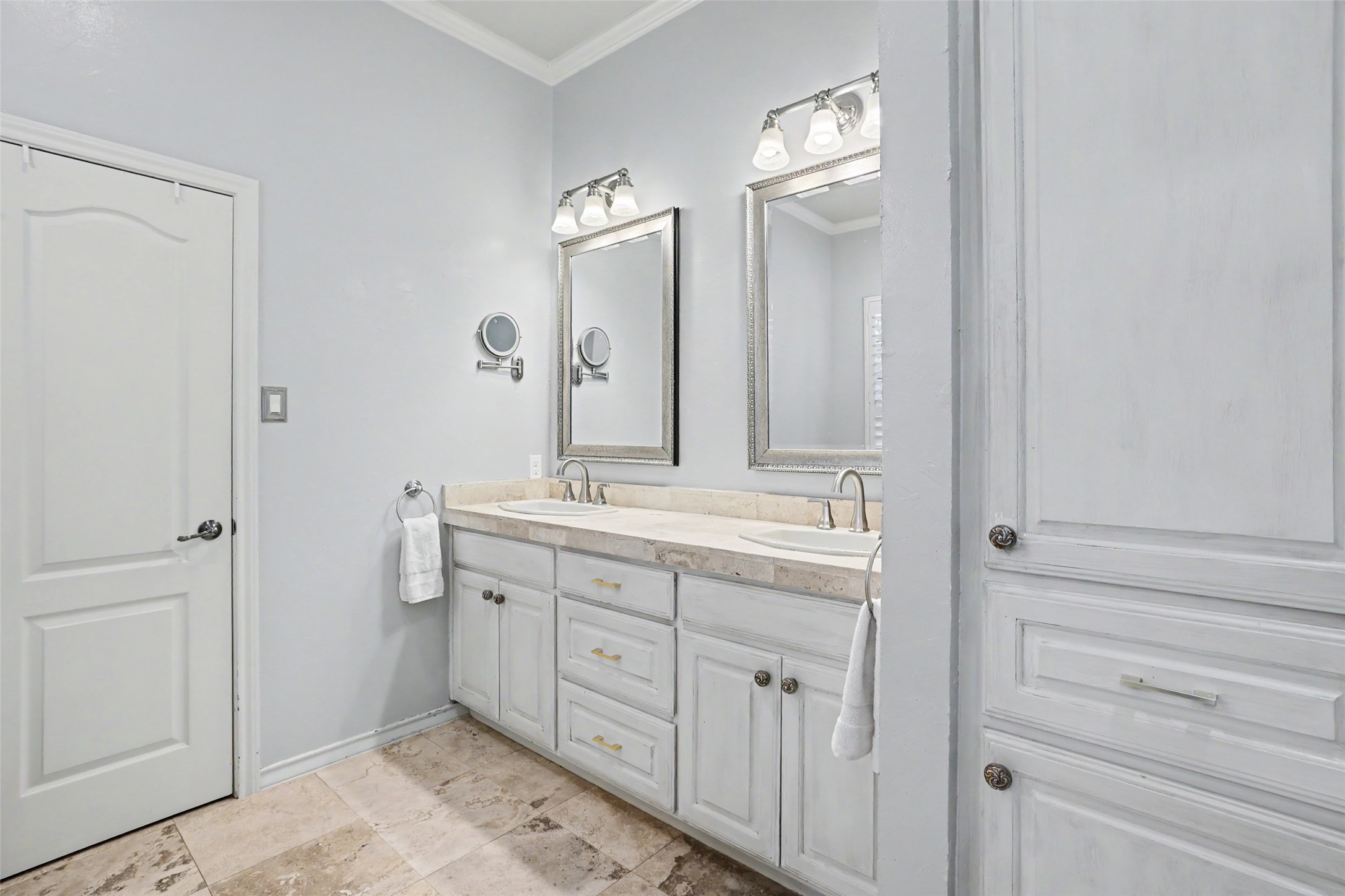 426 Logan Ranch Road Georgetown, TX 78628 - Photo 19 of 40 Double sinks and vanities and a walk in closet decked out with California Closet organization.