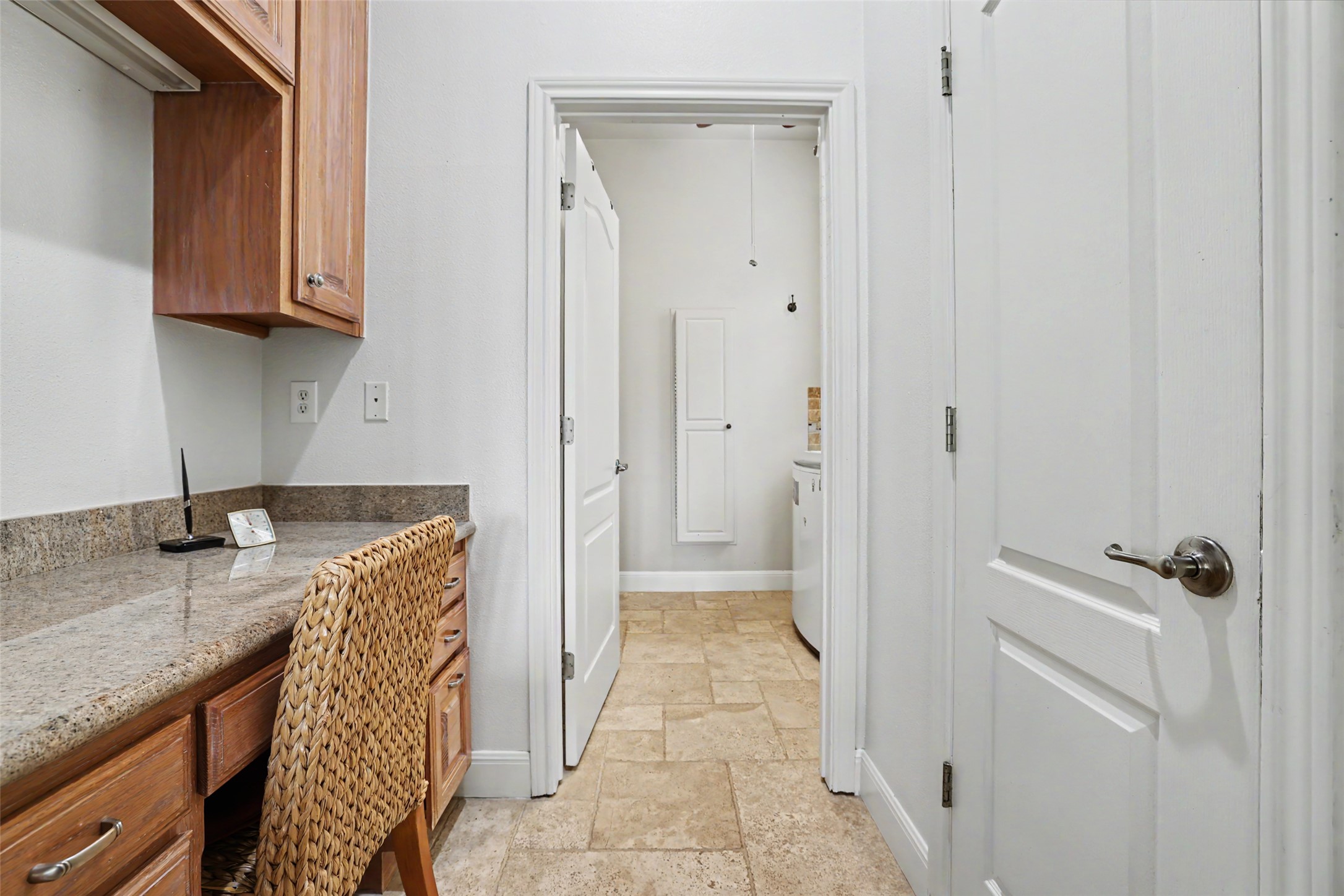 426 Logan Ranch Road Georgetown, TX 78628 - Photo 29 of 40 Heading into the laundry room there is a desk area for all house hold running needs.