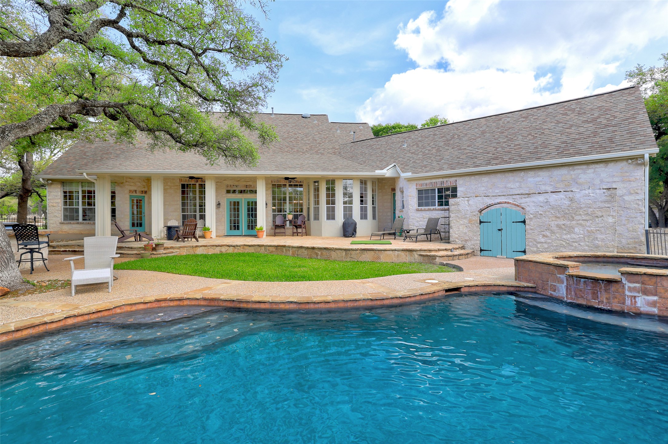 426 Logan Ranch Road Georgetown, TX 78628 - Photo 30 of 40 Wow! Walk outside and there is a pool and outdoor kitchen area along with a hot tub.