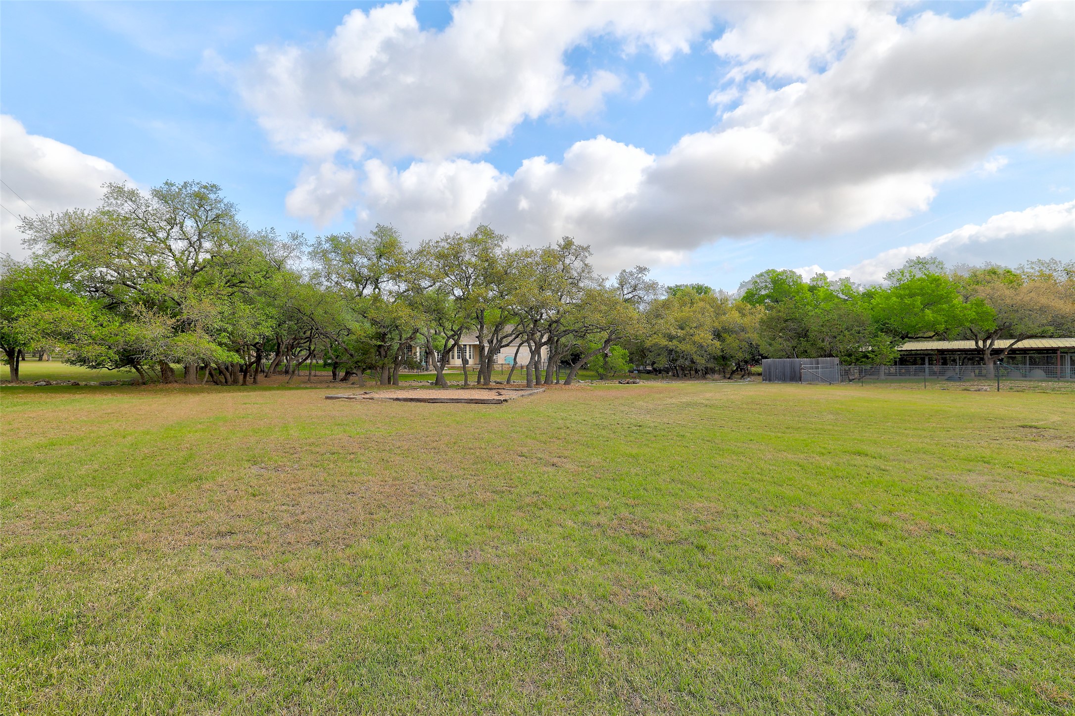 426 Logan Ranch Road Georgetown, TX 78628 - Photo 35 of 40 View and land from beyond the wrought iron fence. Build your own building or guest home here.