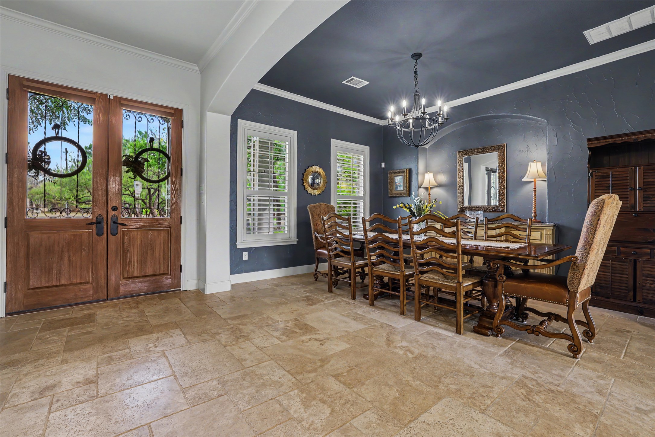 426 Logan Ranch Road Georgetown, TX 78628 - Photo 6 of 40 Walk into the solid metal door and travertine tile to a formal dining room