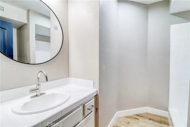 a bathroom with a sink and a window