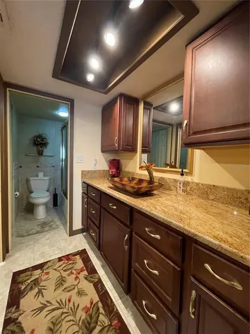 a bathroom with a sink and a large mirror