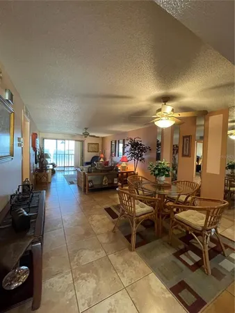 a lobby with furniture and a potted plant