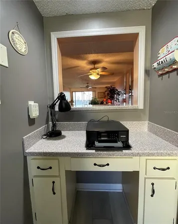 a kitchen with a sink and a window