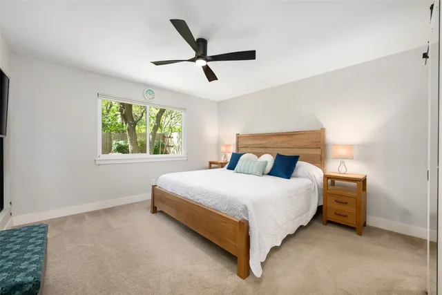a bedroom with a bed and window