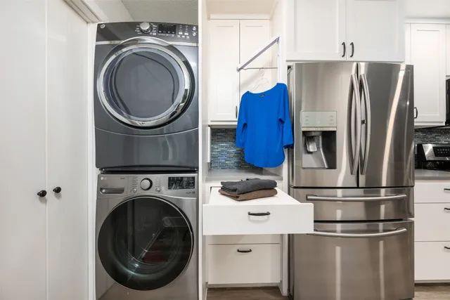 a kitchen with stainless steel appliances a refrigerator and a stove