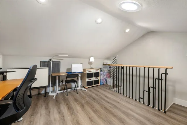 a view of a livingroom with furniture and staircase