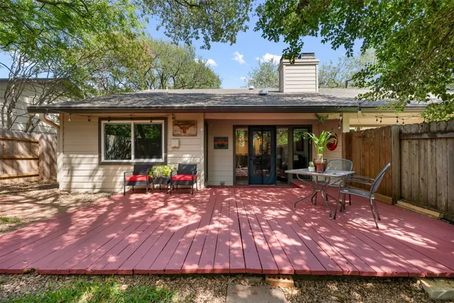 a view of a house with backyard porch and sitting area