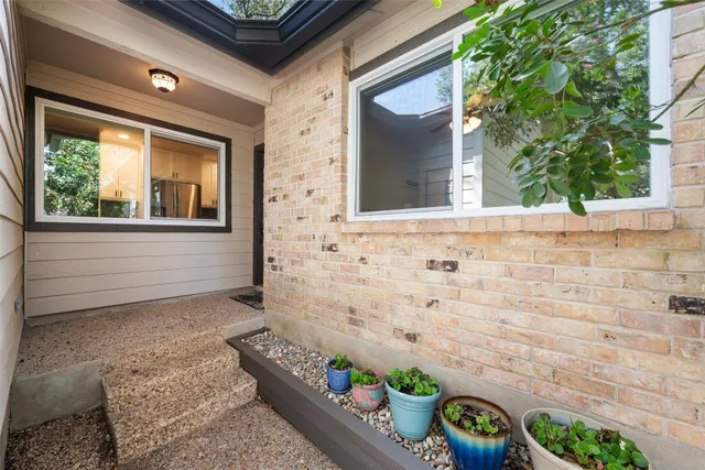 a front view of a house with garden
