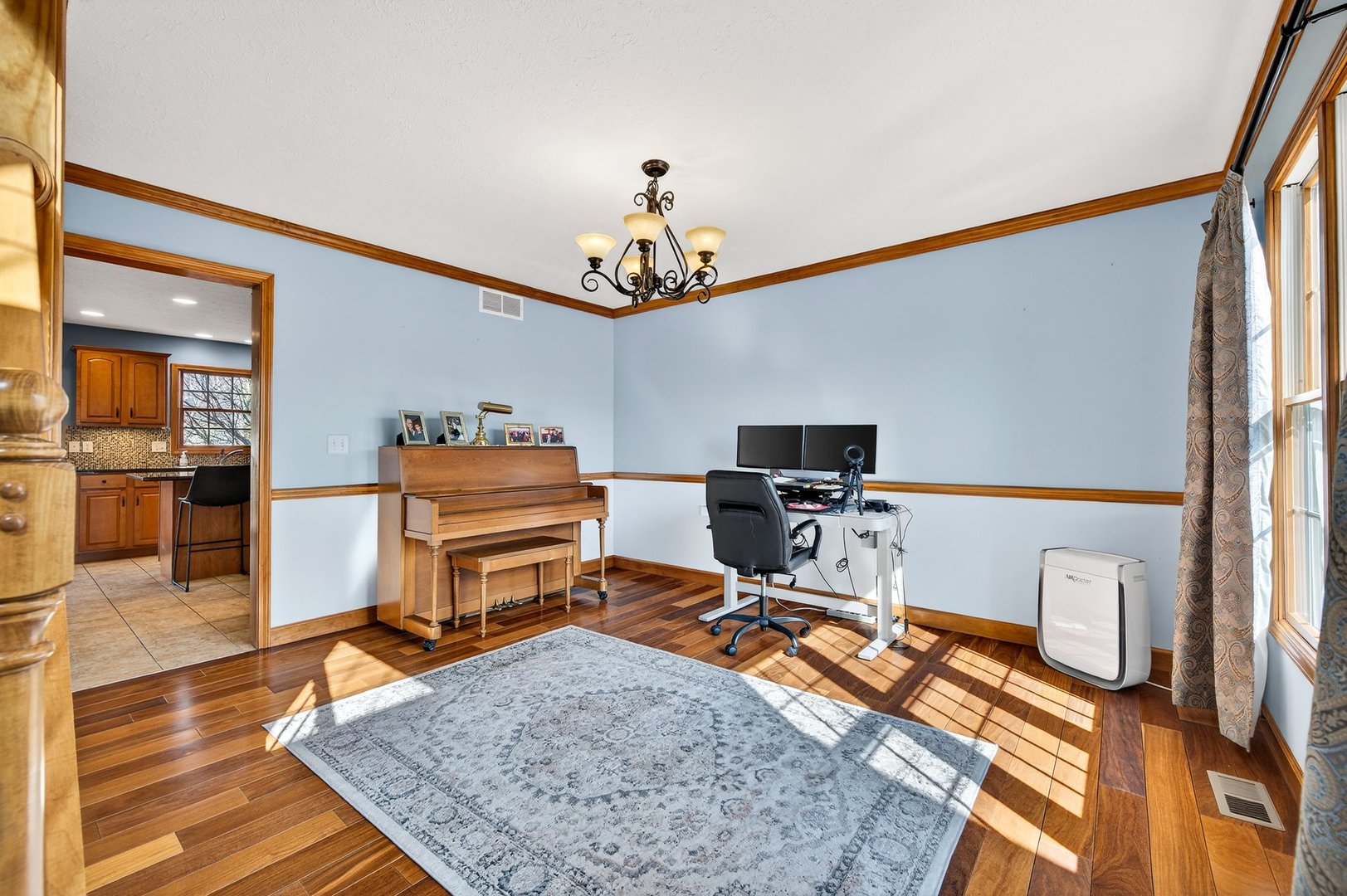 2968 Wolf Creek Lane Normal, IL 61761 - Photo 15 of 47 a bedroom with a bed and a chandelier