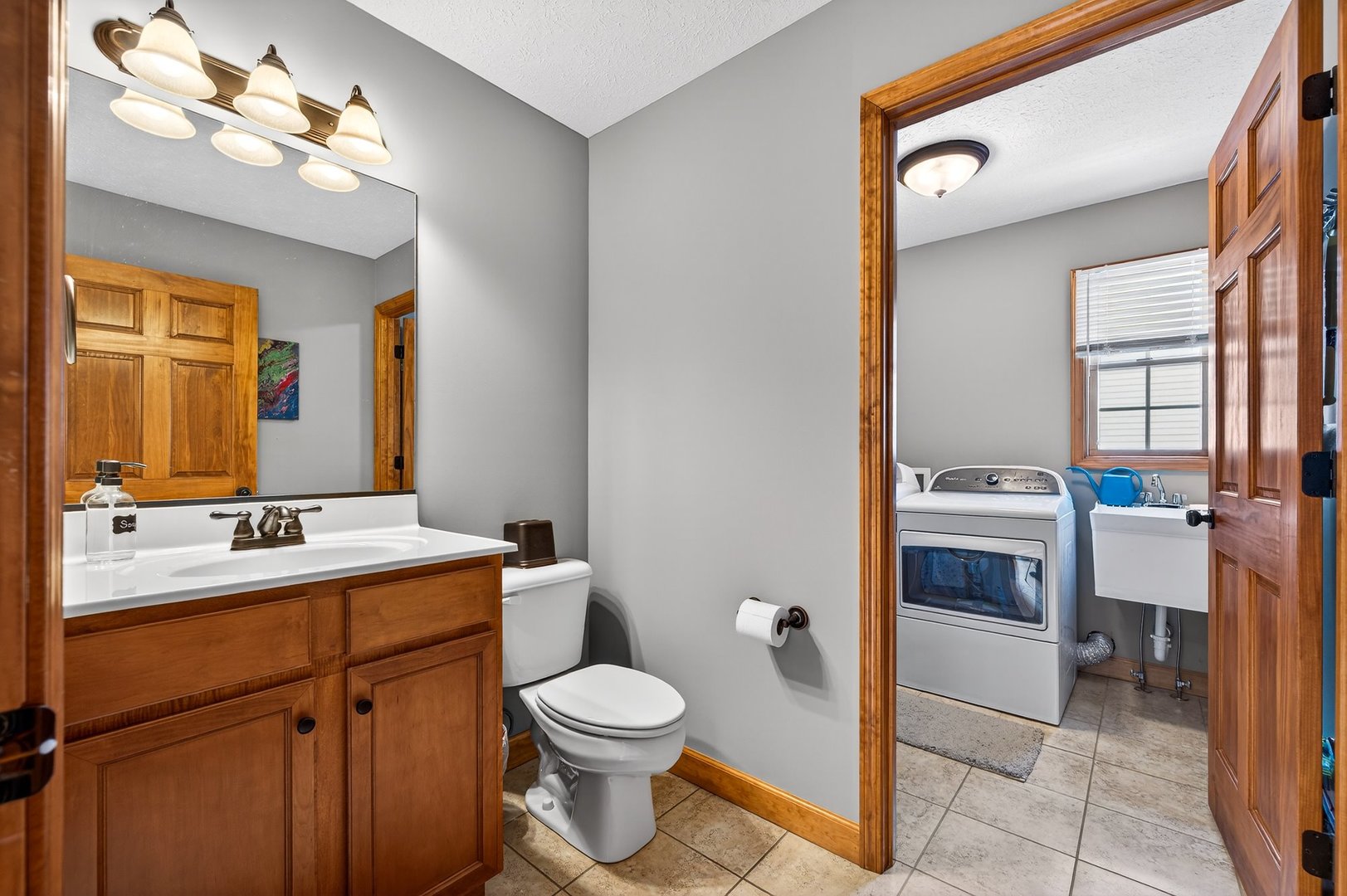2968 Wolf Creek Lane Normal, IL 61761 - Photo 17 of 47 a bathroom with a toilet a sink and mirror