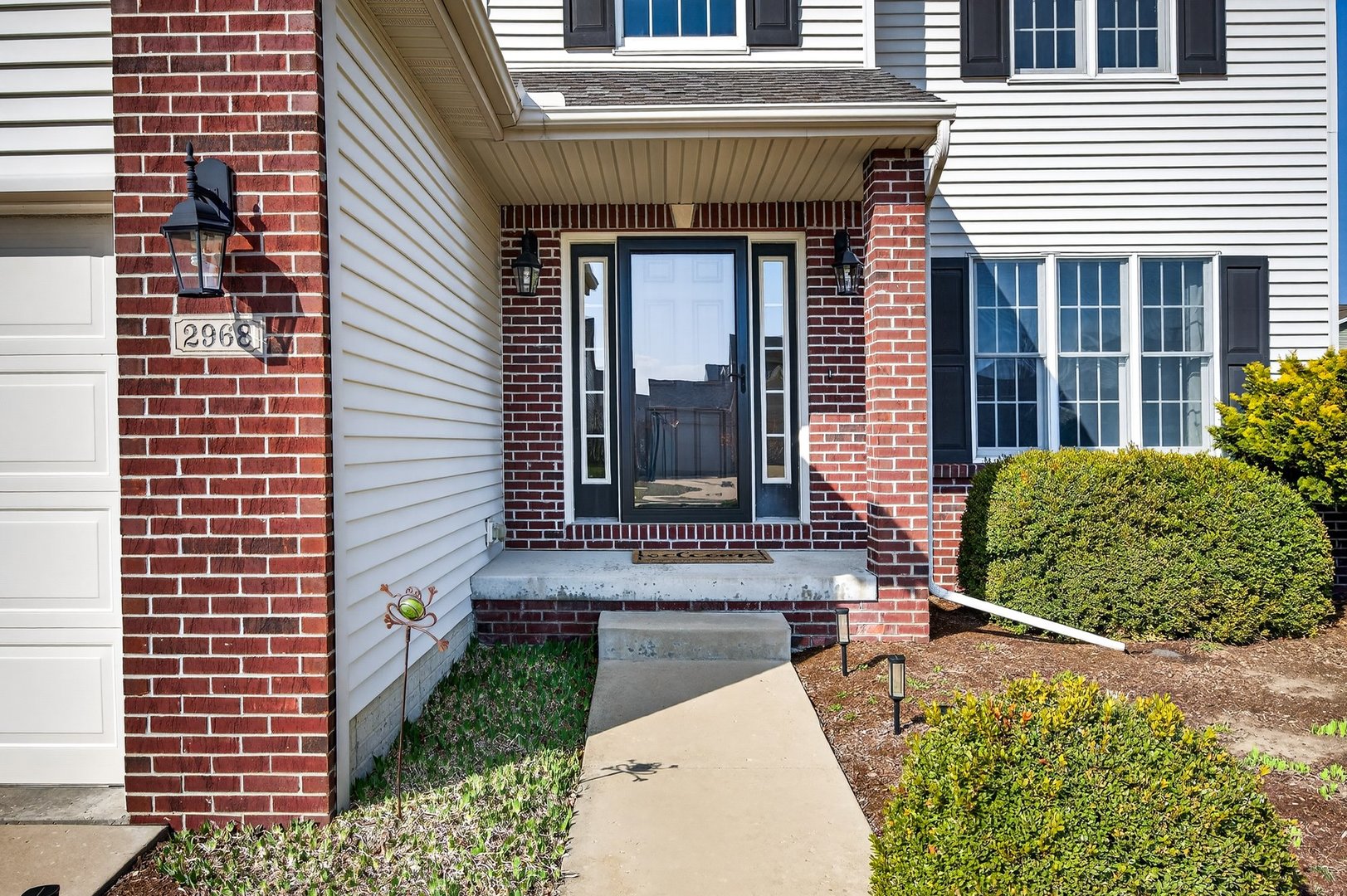 2968 Wolf Creek Lane Normal, IL 61761 - Photo 2 of 47 a front view of a house with a garden