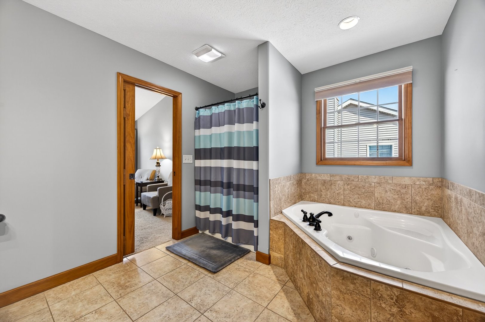 2968 Wolf Creek Lane Normal, IL 61761 - Photo 25 of 47 a bathroom with a bathtub and a shower
