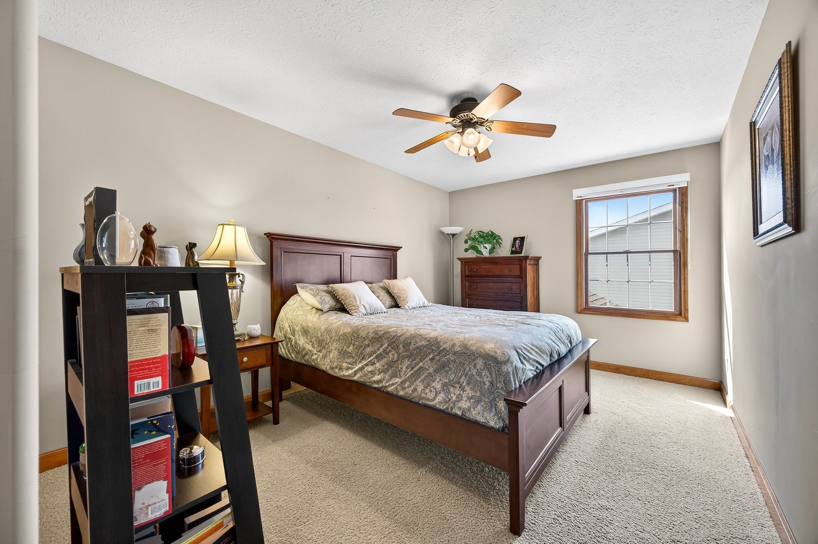 2968 Wolf Creek Lane Normal, IL 61761 - Photo 28 of 47 a spacious bedroom with a bed and wooden floor