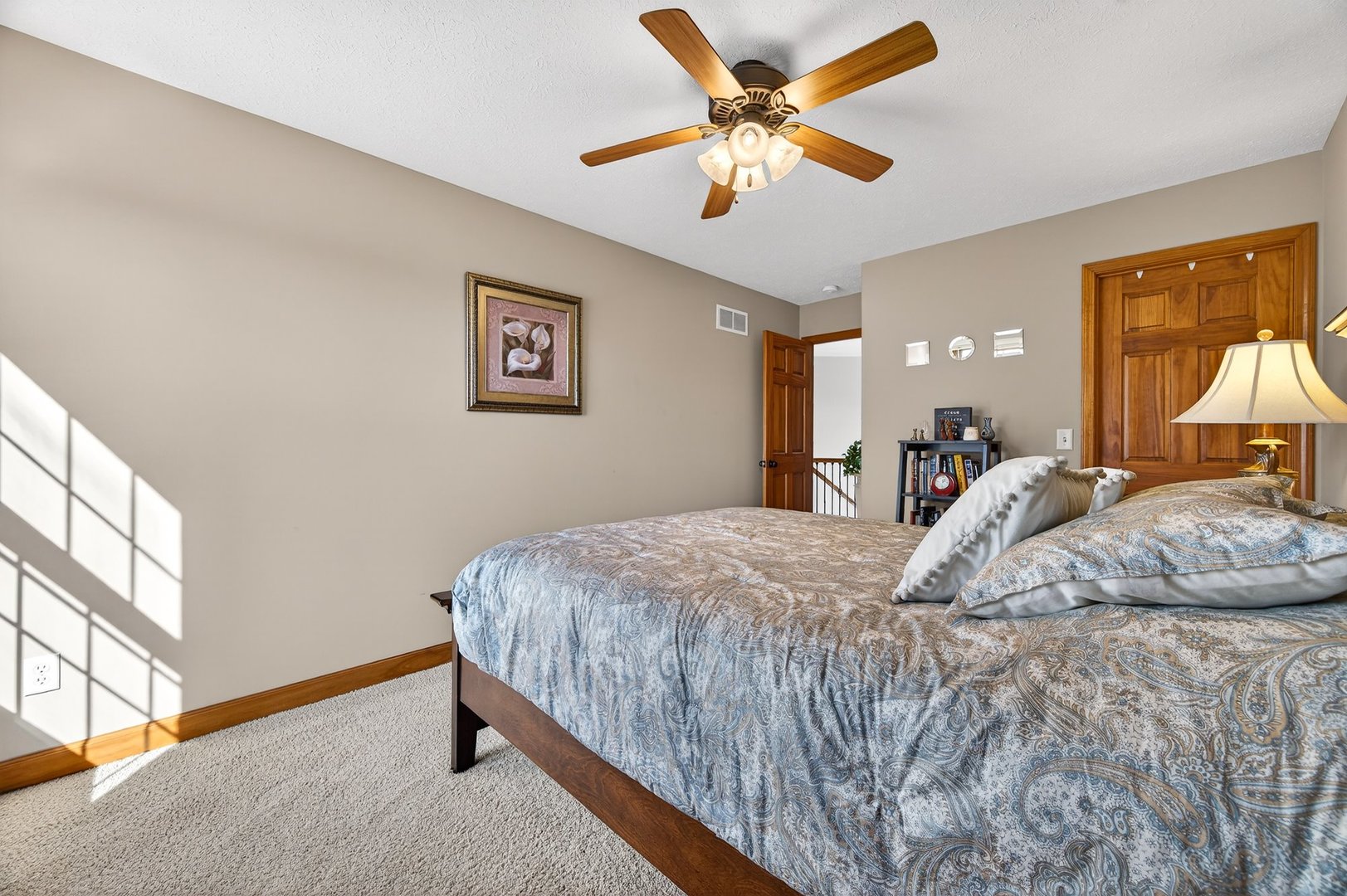 2968 Wolf Creek Lane Normal, IL 61761 - Photo 29 of 47 a bedroom with a bed and a chandelier