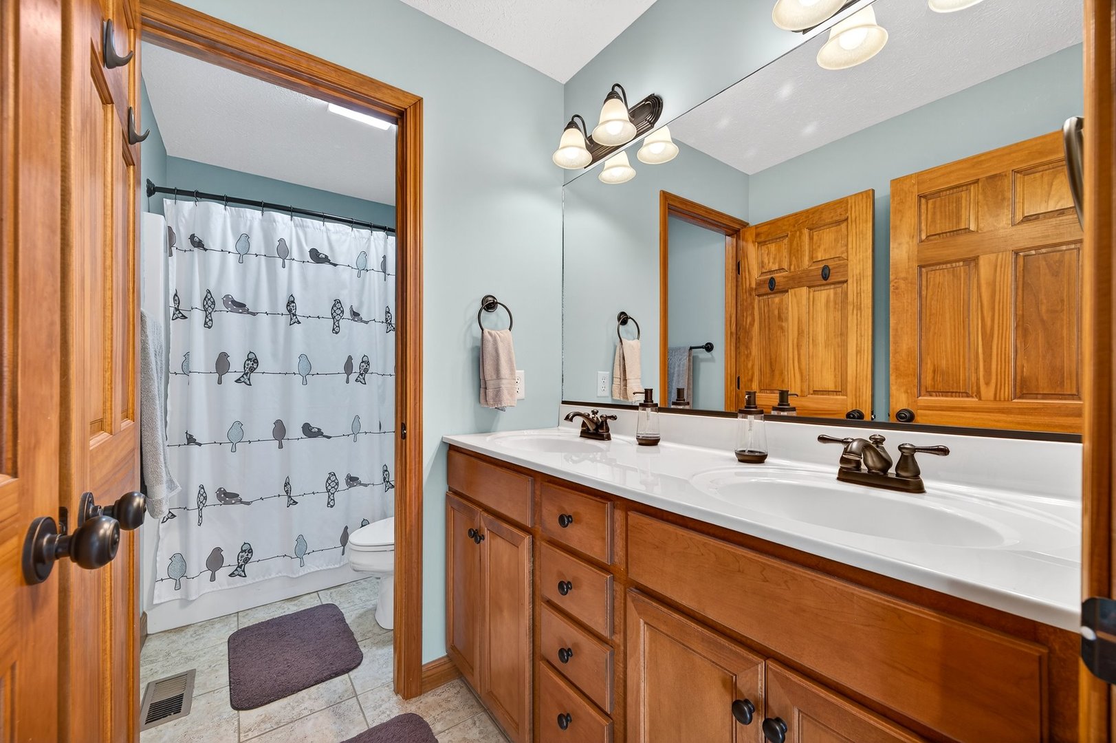 2968 Wolf Creek Lane Normal, IL 61761 - Photo 31 of 47 a bathroom with a double vanity sink mirror and shower