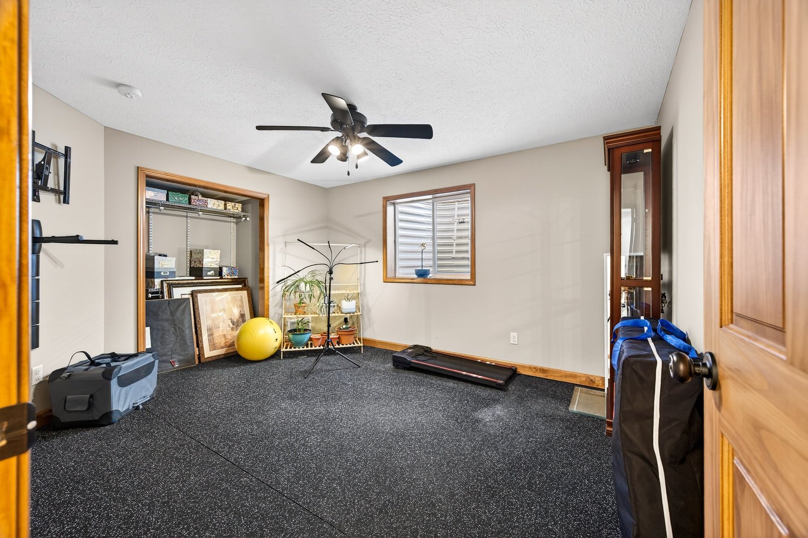 2968 Wolf Creek Lane Normal, IL 61761 - Photo 37 of 47 a view of a livingroom with wooden floor and a ceiling fan