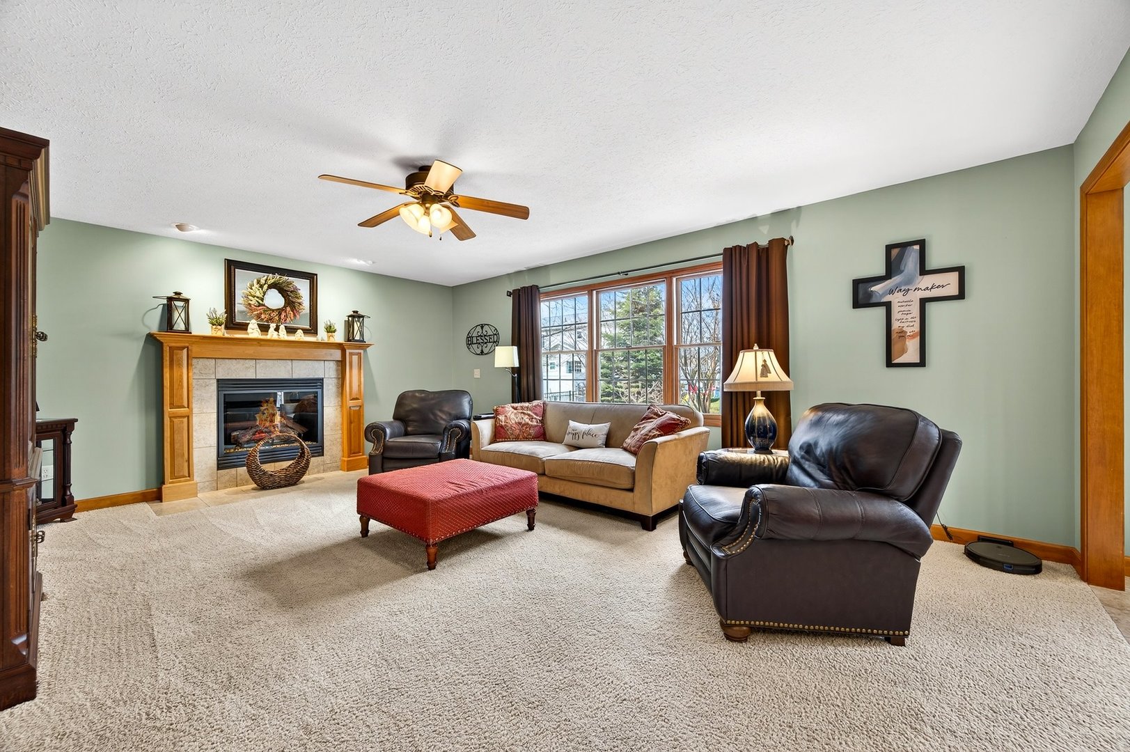 2968 Wolf Creek Lane Normal, IL 61761 - Photo 5 of 47 a living room with furniture large window and a fireplace