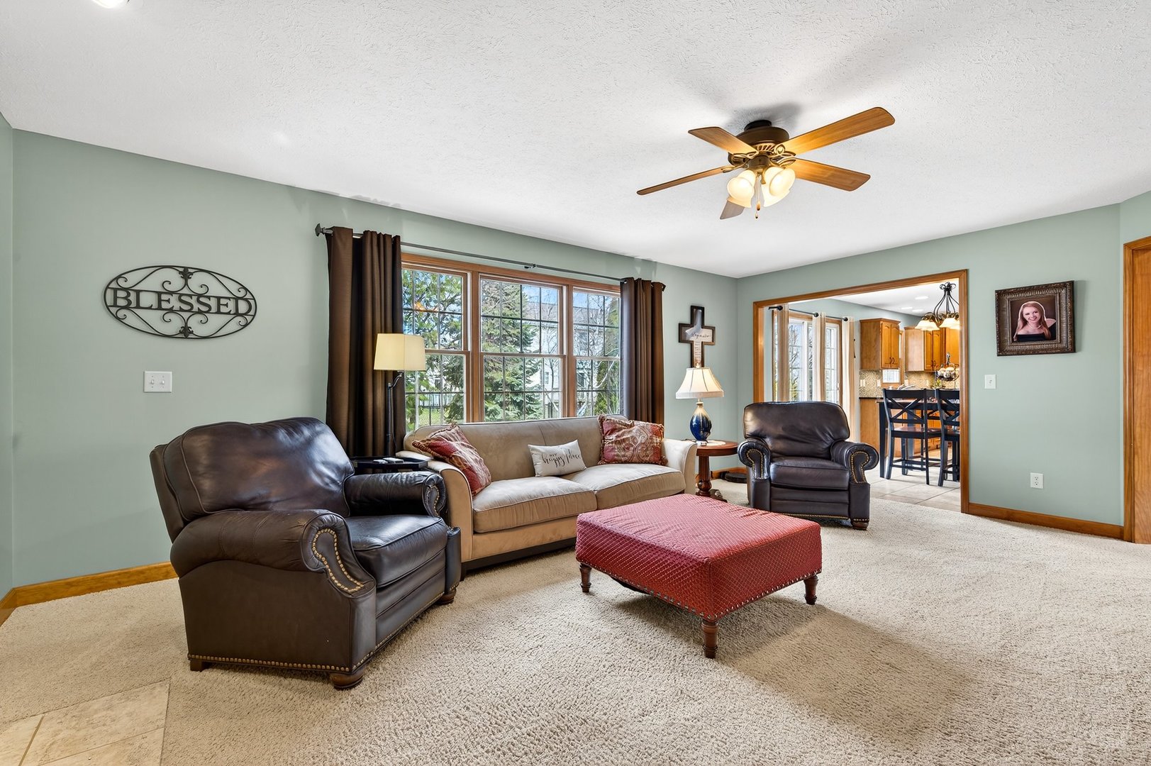 2968 Wolf Creek Lane Normal, IL 61761 - Photo 7 of 47 a living room with furniture ceiling fan and a window