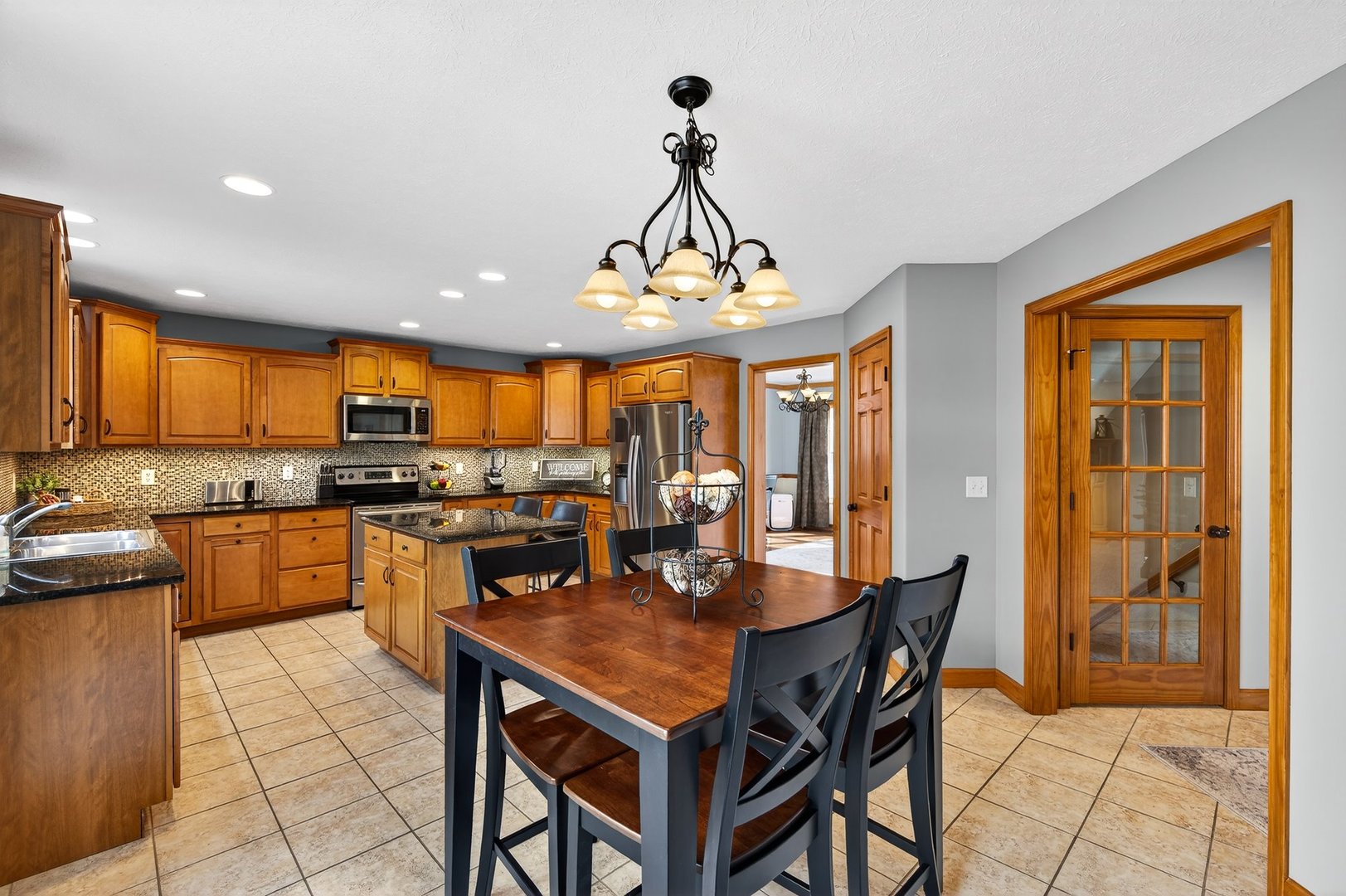 2968 Wolf Creek Lane Normal, IL 61761 - Photo 9 of 47 a view of a dining room with furniture window and wooden floor