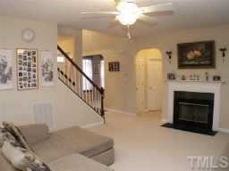 3624 Pritchard Court Raleigh, NC 27616 - Photo 2 of 12 a view of a livingroom with furniture fire place and refrigerator