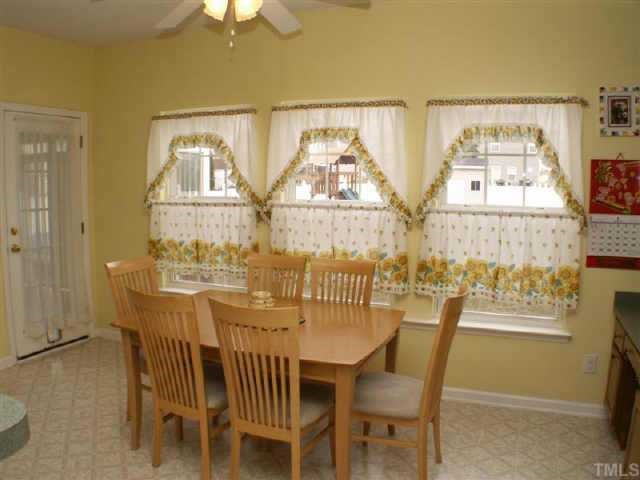 3624 Pritchard Court Raleigh, NC 27616 - Photo 5 of 12 a view of a dining room with furniture and a window