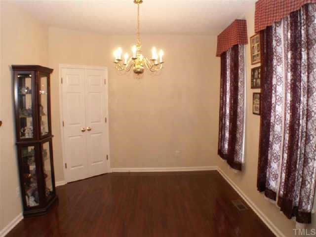 3624 Pritchard Court Raleigh, NC 27616 - Photo 6 of 12 a view of a room with window and hardwood floor