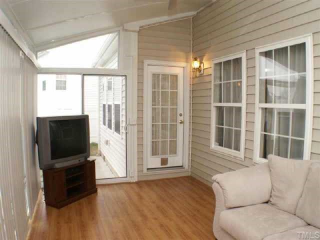 3624 Pritchard Court Raleigh, NC 27616 - Photo 10 of 12 a living room with furniture windows and flat screen tv