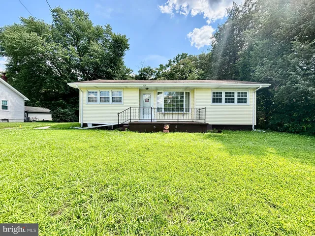 a view of a house with a big yard