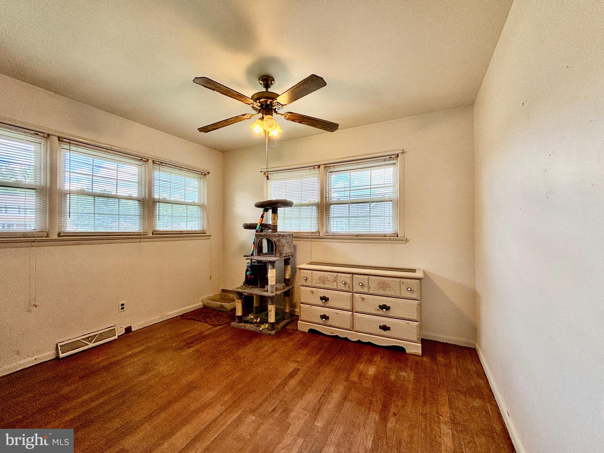 123 South Pemberton Road Pemberton, NJ 08068 - Photo 12 of 16 a view of room with wooden floor and windows
