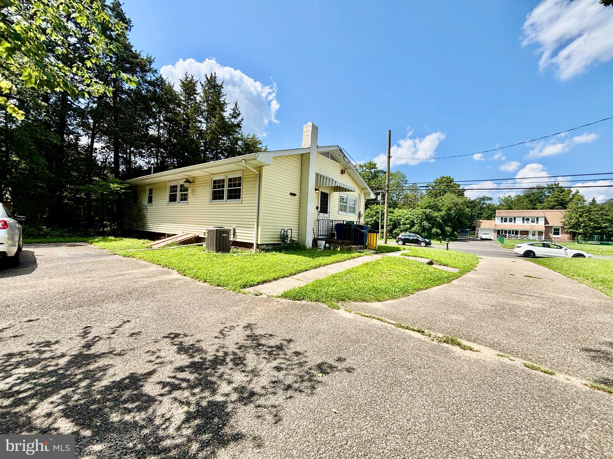 123 South Pemberton Road Pemberton, NJ 08068 - Photo 16 of 16 a front view of a house with a yard and garage