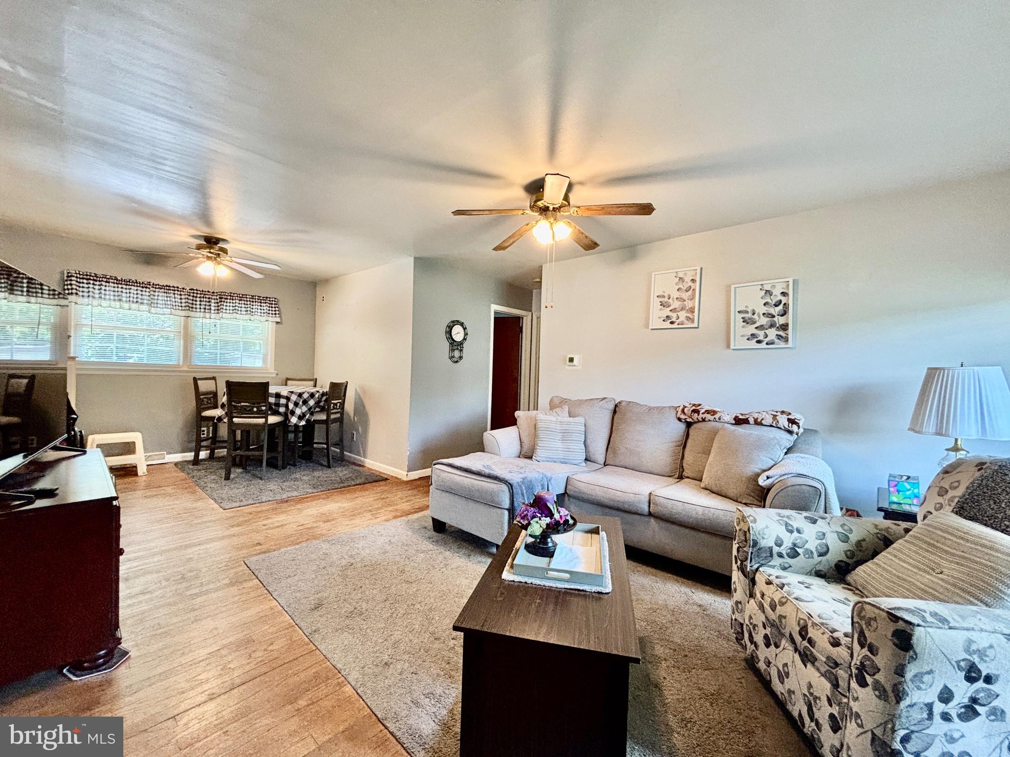 123 South Pemberton Road Pemberton, NJ 08068 - Photo 6 of 16 a living room with furniture and a chandelier