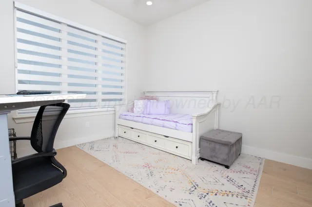 a kitchen with stainless steel appliances a sink and a refrigerator