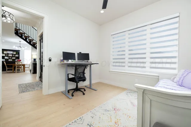 a kitchen with stainless steel appliances granite countertop a sink and a refrigerator