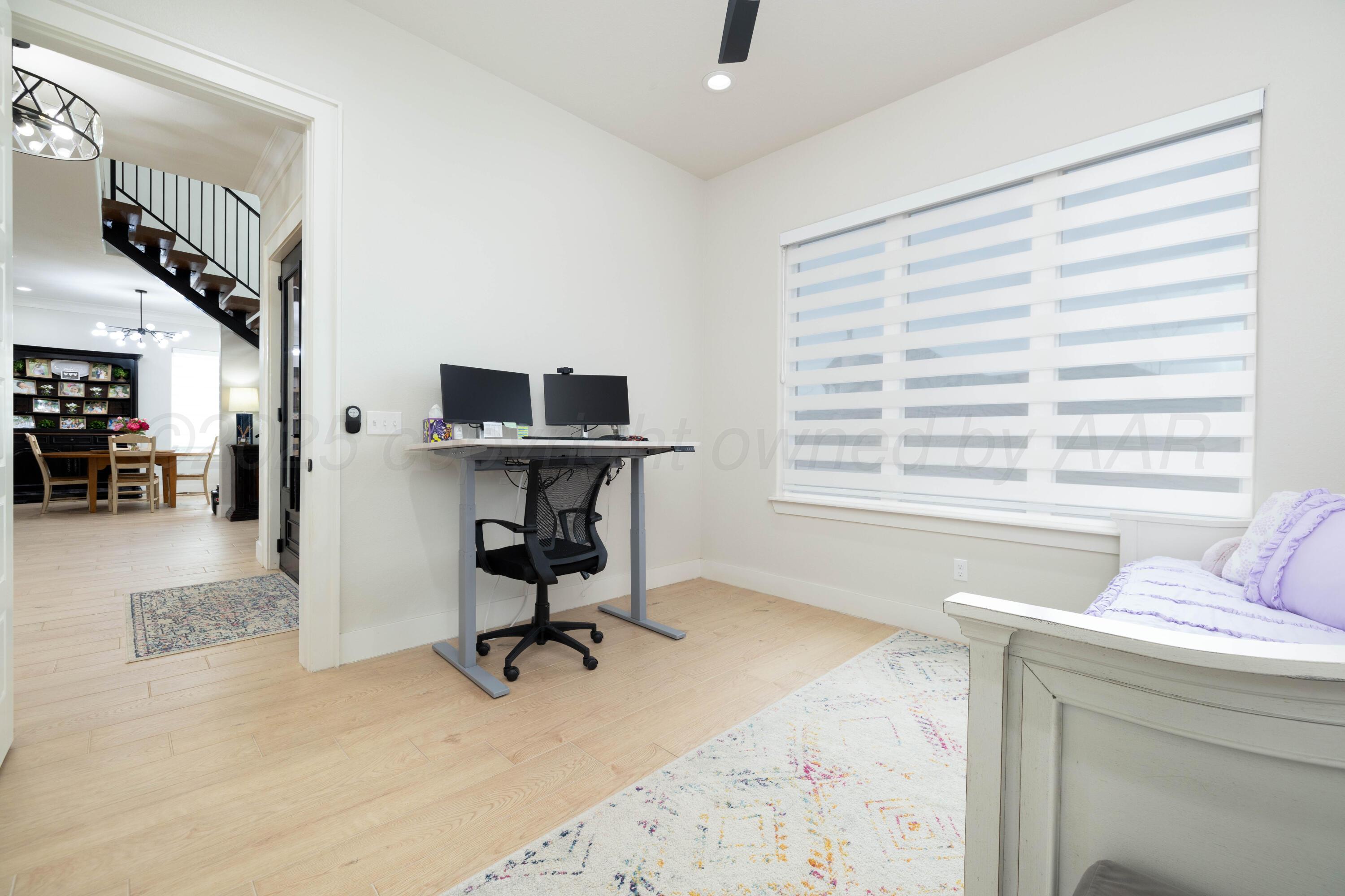 9507 Meadow Ridge Amarillo, TX 79118 - Photo 15 of 56 a view of a livingroom with workspace and a window