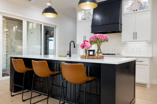 a kitchen with sink cabinets and window