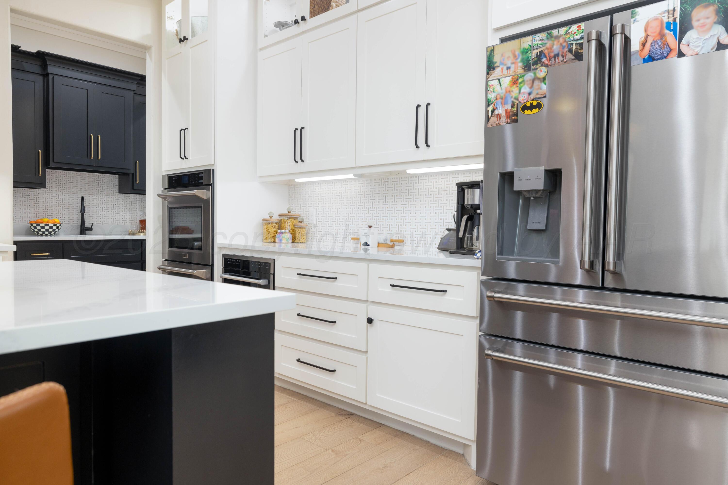 9507 Meadow Ridge Amarillo, TX 79118 - Photo 25 of 56 a kitchen with stainless steel appliances a refrigerator and cabinets