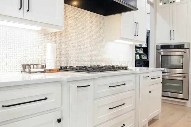 a bedroom with a bed dresser and a window