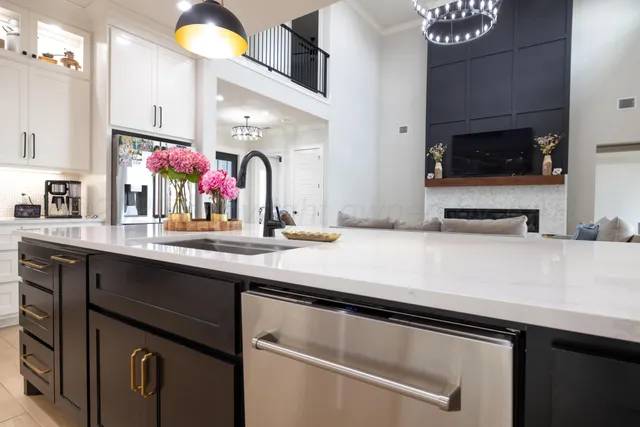 a spacious bathroom with a tub sink and mirror